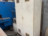 a refrigerator that is sitting in the middle of a room