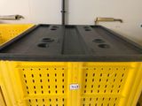 a yellow crate with a black top and a black lid
