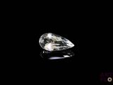 a close up of a diamond on a black surface