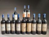 several bottles of wine are lined up in a row on a table