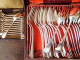 a box with a bunch of silverware in it