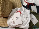 a hat, shirt, and other items that are on a table