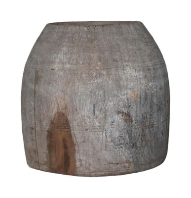 a large vase that is sitting on a white surface