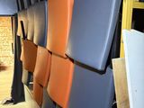 a lot of chairs that are lined up in a room