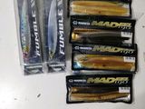 several fishing lures are lined up on a counter top