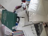 a pile of books and other items on the floor