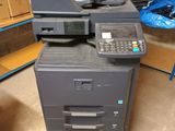 an image of a multi - function printer in a warehouse