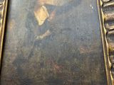 an old picture of a man in a suit is hanging on a wall