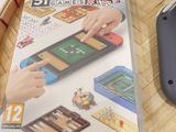 nintendo wii game console with wii game and accessories sitting on a wicker table