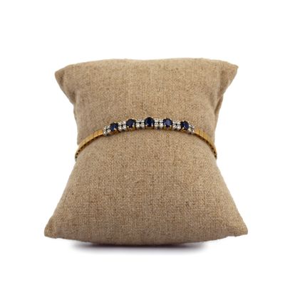 a close up of a cushion with a pillow on it
