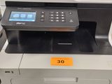 the printer is sitting on top of the table in the store