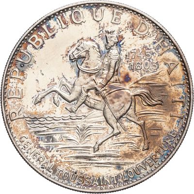 an old silver coin with a horse and rider on it