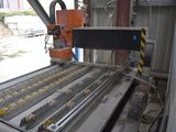 an image of a machine that is working on a conveyor belt