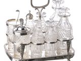 a silver tray with a lot of glass items on it