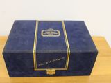 a close up of a blue box on a wooden table