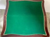 an image of a table with a green cloth on top of it