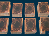 six decks of playing cards sitting on top of each other on a blue surface