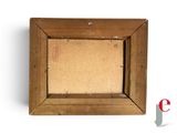 an old picture frame with a brown paper and a red marker