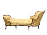 an image of a chaise lounger made of wood and upholstered with a yellow upholstered seat