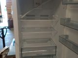 an open refrigerator that is sitting in a room