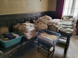 a room with a lot of boxes and baskets on the floor