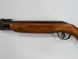 a rifle on a white background