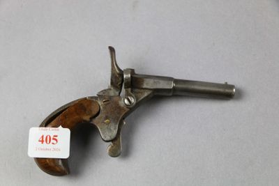 a close up of a gun on a table with a price tag on it
