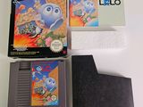a box of nintendo games and a game card on a table