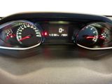 a close up of a car dashboard with a speedometer and gauges