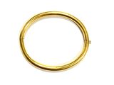 a close up of a gold ring on a white surface