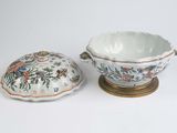 a bowl and a bowl with a lid on a table