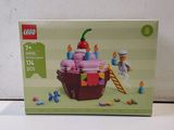 a box of legos with a cupcake on it