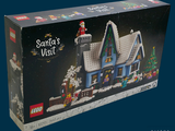 une boîte contenant une maison de Noël en Lego