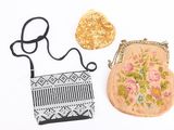 three purses that are sitting on a white surface