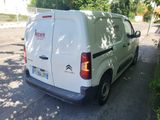 a white van that is parked on the side of the road