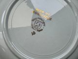 a close up of a plate with a picture of a lion on it