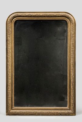 an antique gold framed mirror with a black background