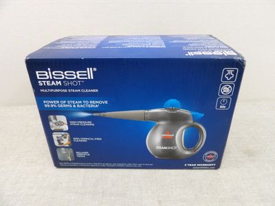the box of a blow dryer is sitting on a table