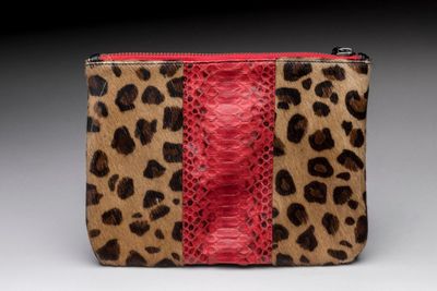 an image of a leopard print purse with a red stripe