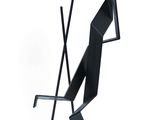 abstract metal sculpture of a man holding a cane
