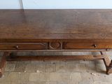a wooden table with a drawer on it on a hard wood floor