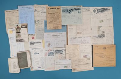 a blue wall with many old papers on it