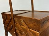 a wooden box that has a handle on it