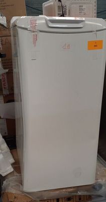 a white refrigerator sitting on a pallet in a warehouse