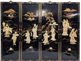 an image of a black and gold screen with asian figures on it
