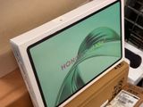a box with a computer on top of it sitting on a table