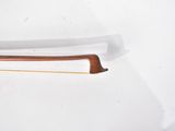 a white plate with a wooden handle on it