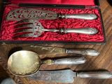 silverware in a red case on a wooden table with a red cloth