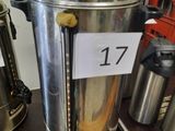 a coffee urn on a table with a price tag on it