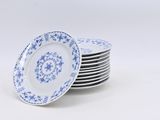 several plates with blue and white designs are stacked on top of each other